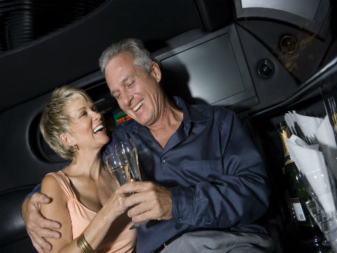 Older Couple Smiling inside a Party Bus from OKC LIMO